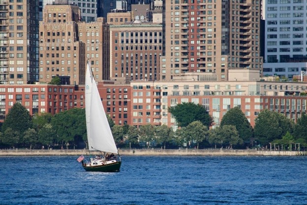 A boat on water near a New Jerscy City